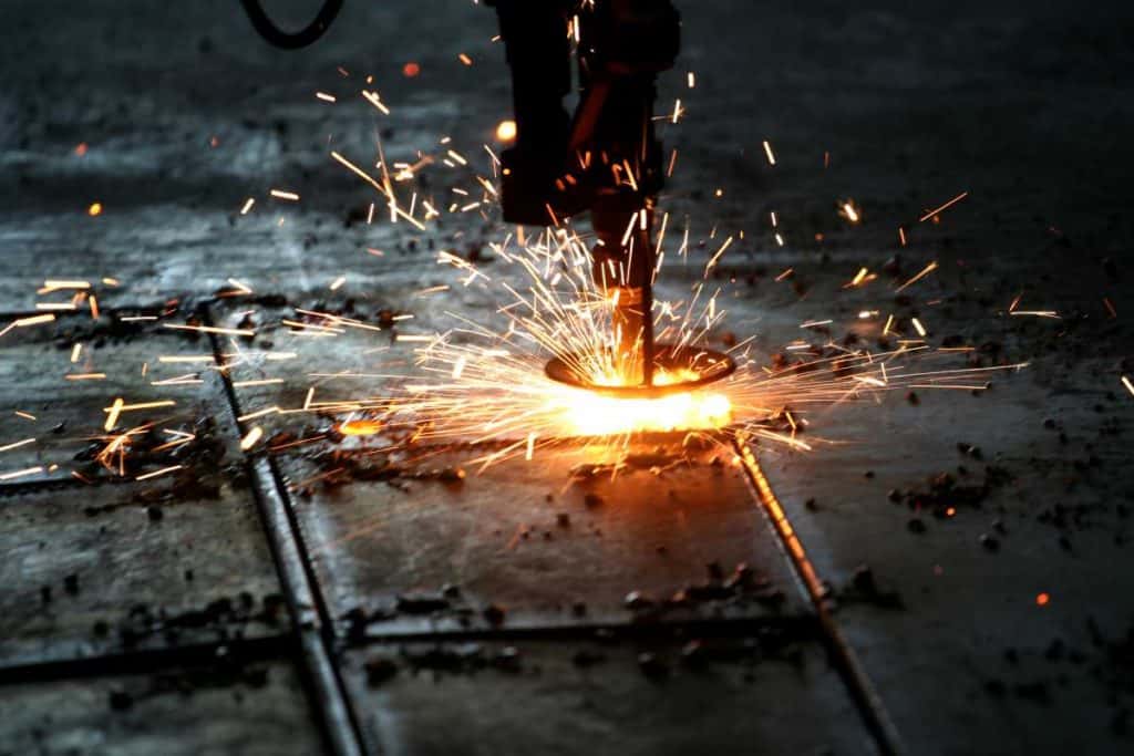 Industrial Laser cutting metal with sparks (2)