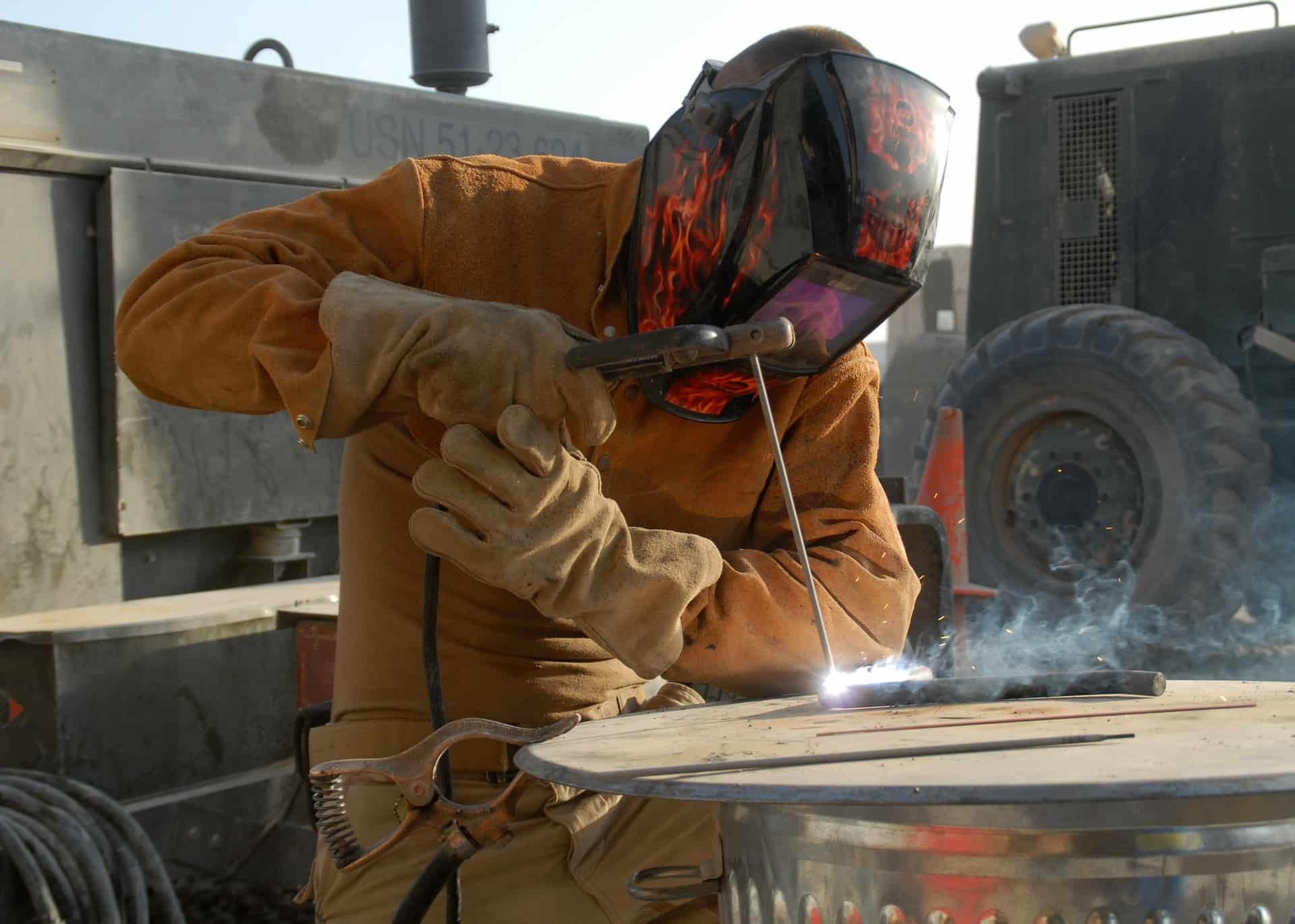 man welding metal